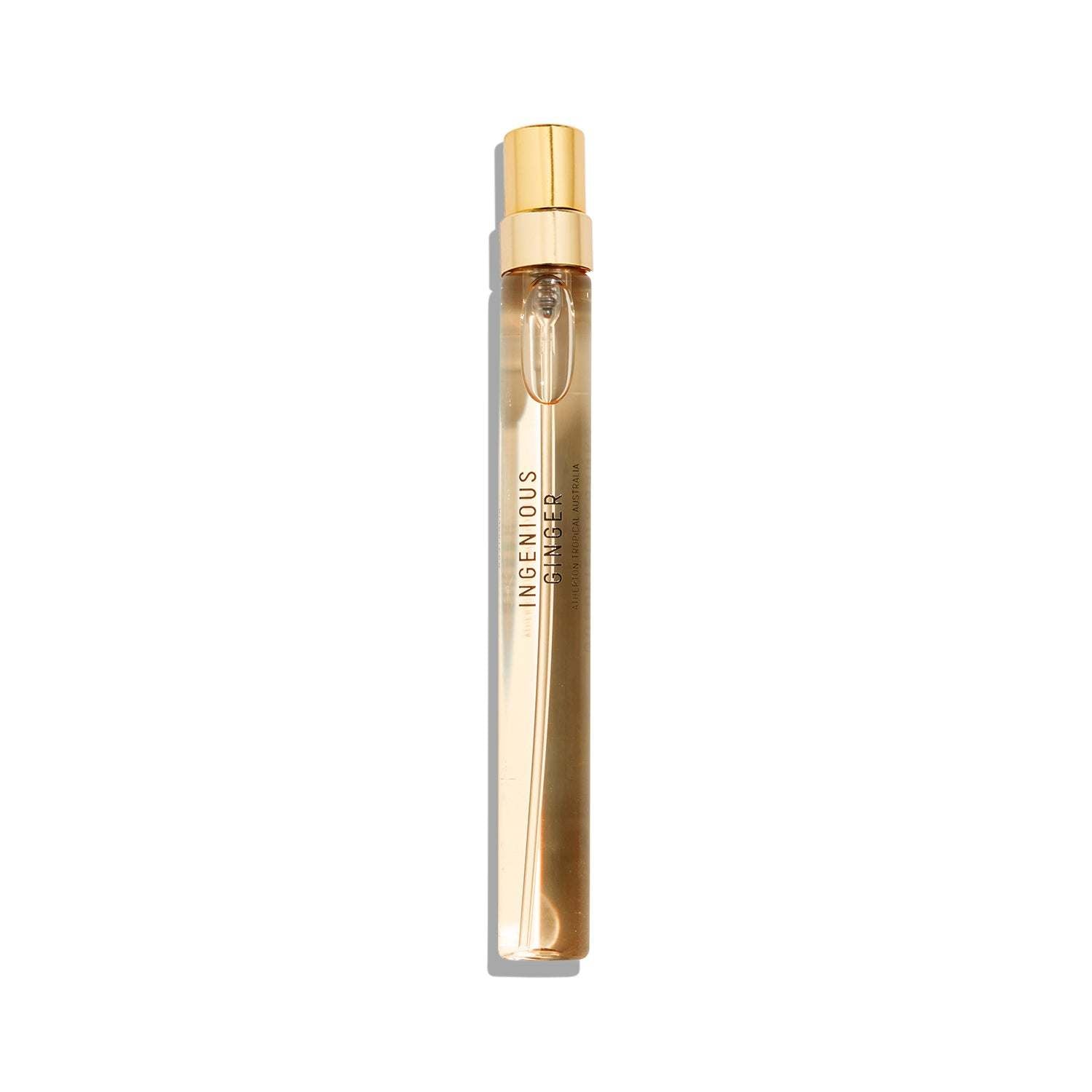 Ingenious Ginger sleek gold-capped perfume spray bottle on white background